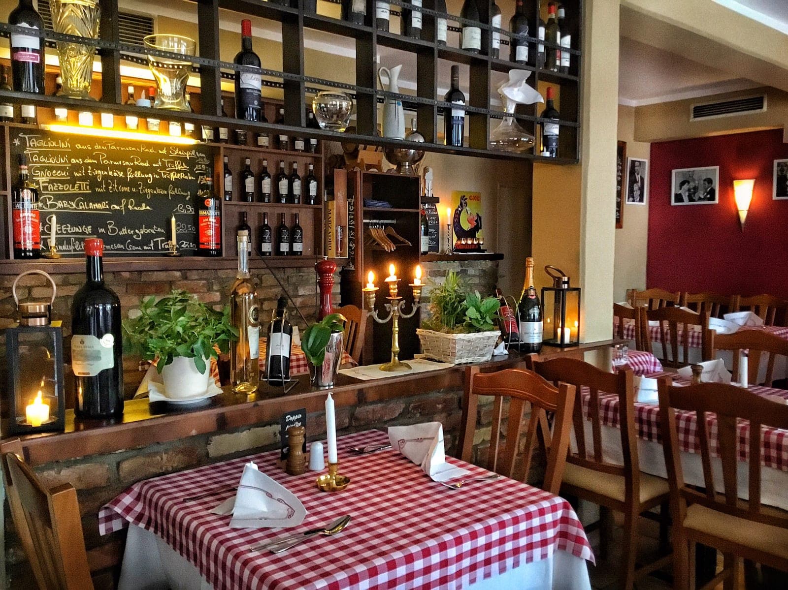 The dining room of AL Dente by candlelight