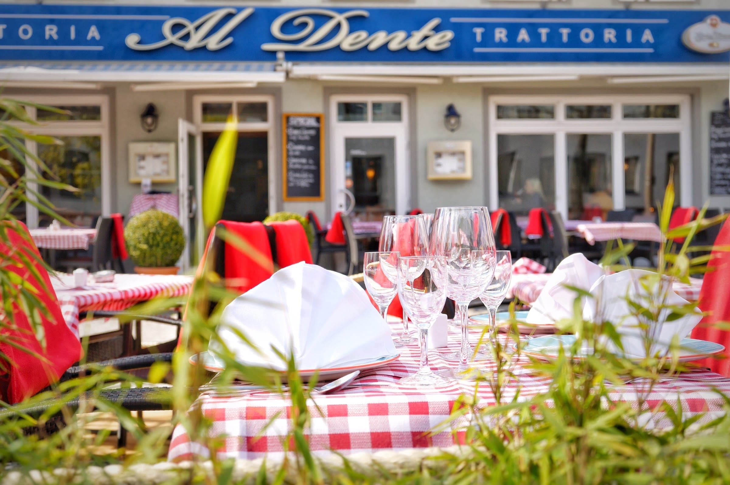 Laid tables on the terrace of the trattoria AL Dente