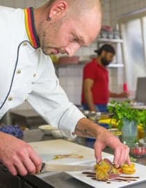 Head chef Dominik plating a dish