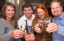 The team raising a toast together